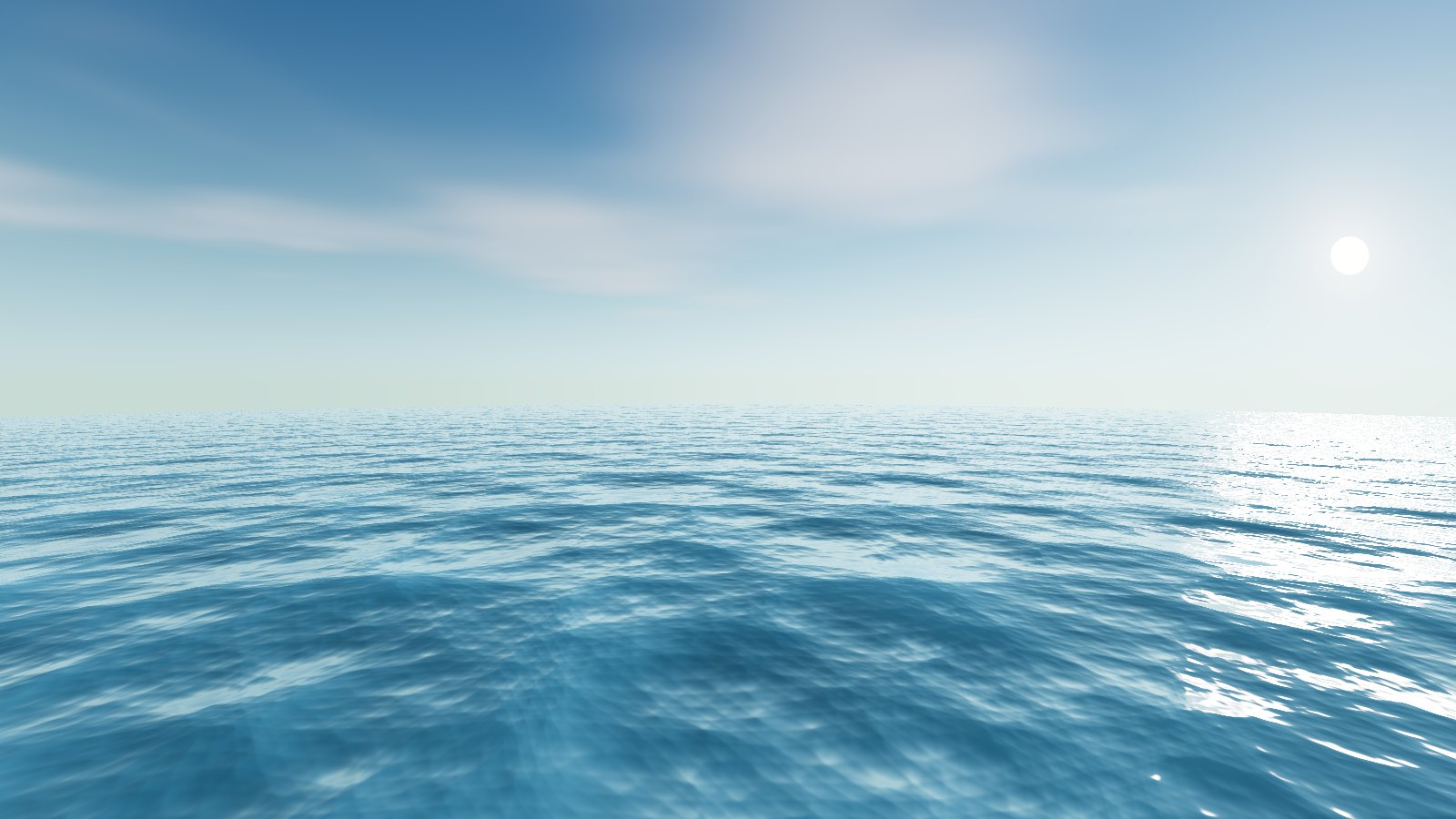 The same view by day: the sun low over a bright sea, with clouds